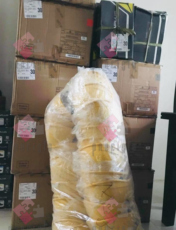 Yellow DELTA PLUS hardhats in plastic packaging
